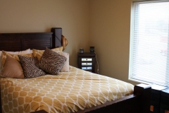 A bed with pillows and blankets on it