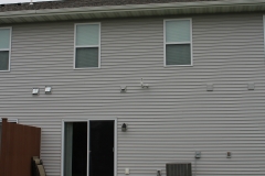 A house with two windows and a door.